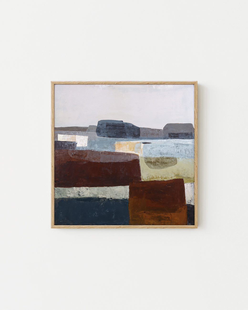 Abstract art piece with geometric shapes in earthy tones on a light background